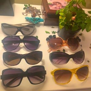 7 Like new sunglasses $5 each or buy them all for $20